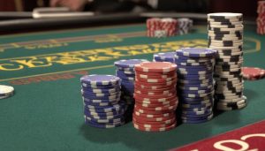 stacks of casino chips on blackjack table